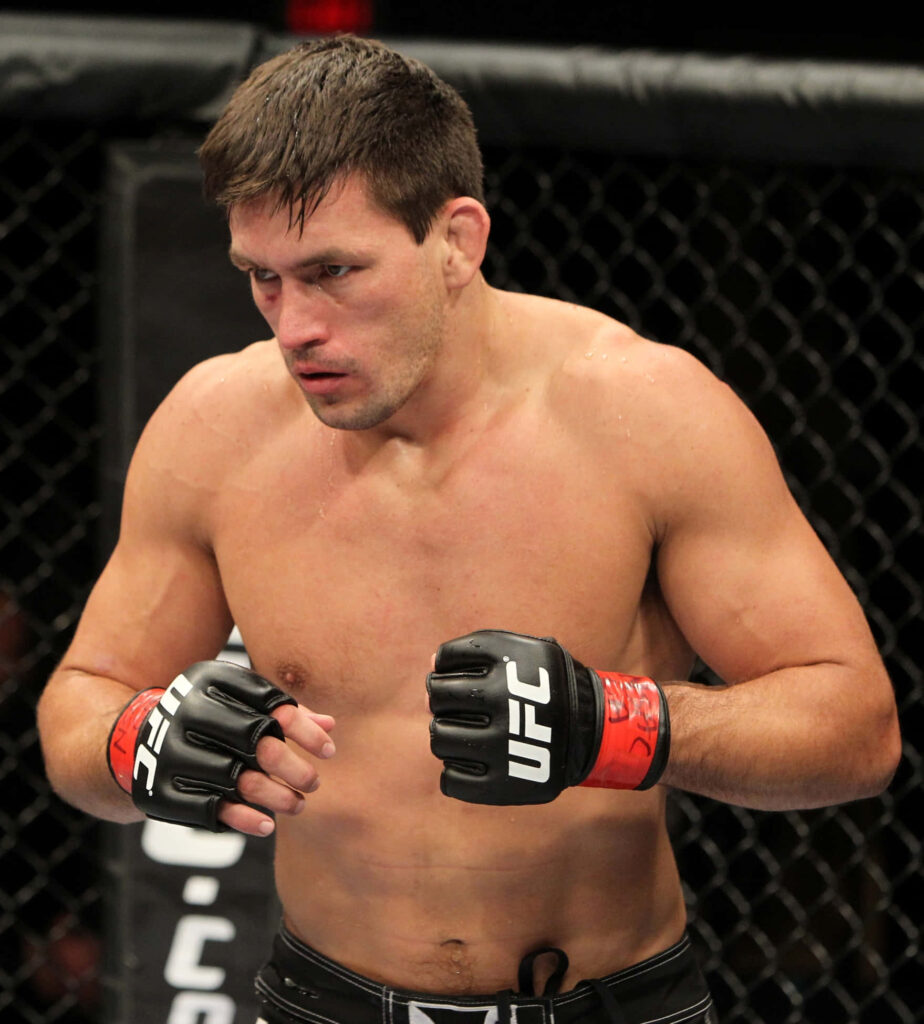 Demian Maia UFC fighter focused inside octagon showcasing athletic physique and intense expression Wallpaper