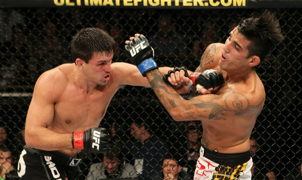 Demian Maia punches Kendall Grove in intense UFC fight inside octagon with dynamic action Wallpaper
