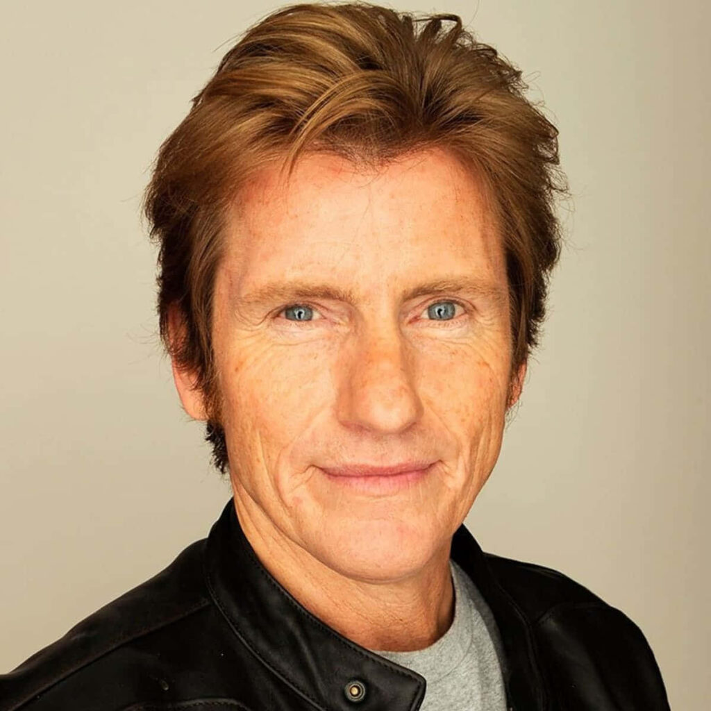 Close-up portrait of Denis Leary in leather jacket with calm confident expression neutral background Wallpaper