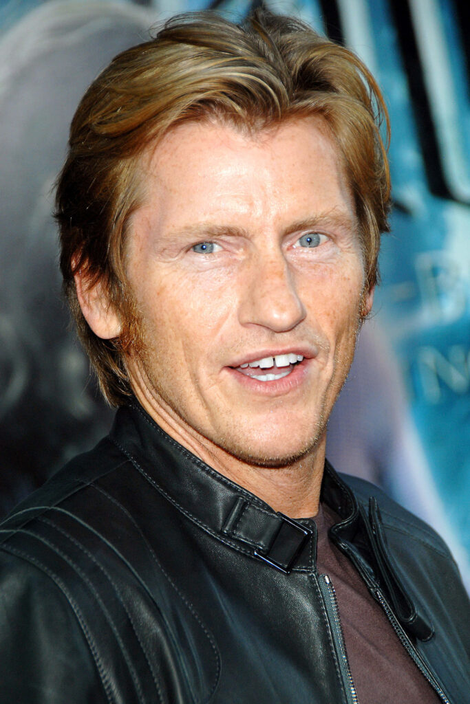 Denis Leary close-up portrait with sandy hair and relaxed smile on blue white background wallpaper