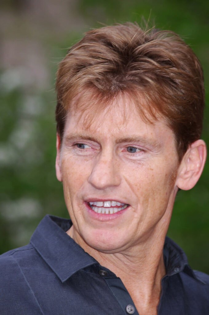 Denis Leary close-up portrait in natural sunlight with soft green blurred background wallpaper