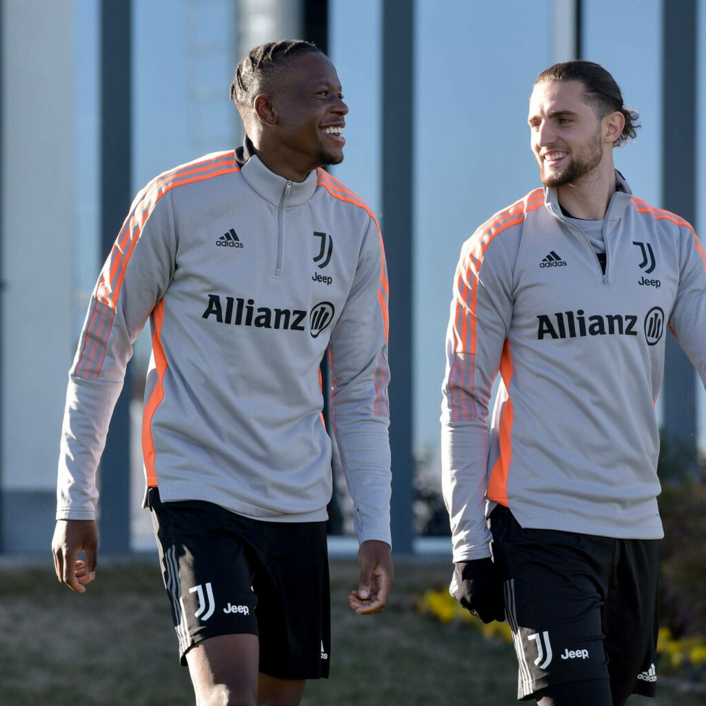 Denis Zakaria and Adrien Rabiot Juventus training session grey orange Adidas kits outdoor background Wallpaper