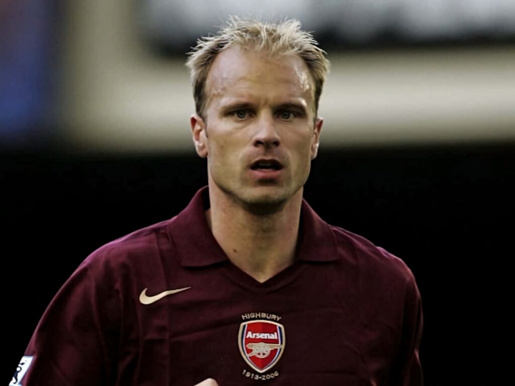 Dennis Bergkamp in classic Arsenal maroon kit during Highbury era match versus Fulham Wallpaper