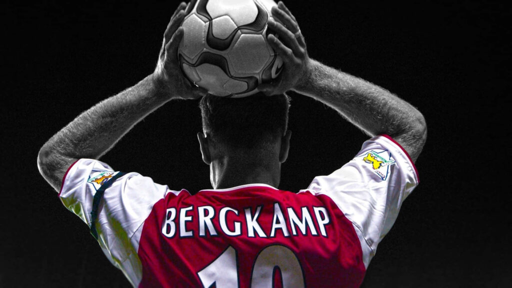 Dennis Bergkamp Arsenal number 10 preparing for throw-in with dramatic lighting wallpaper