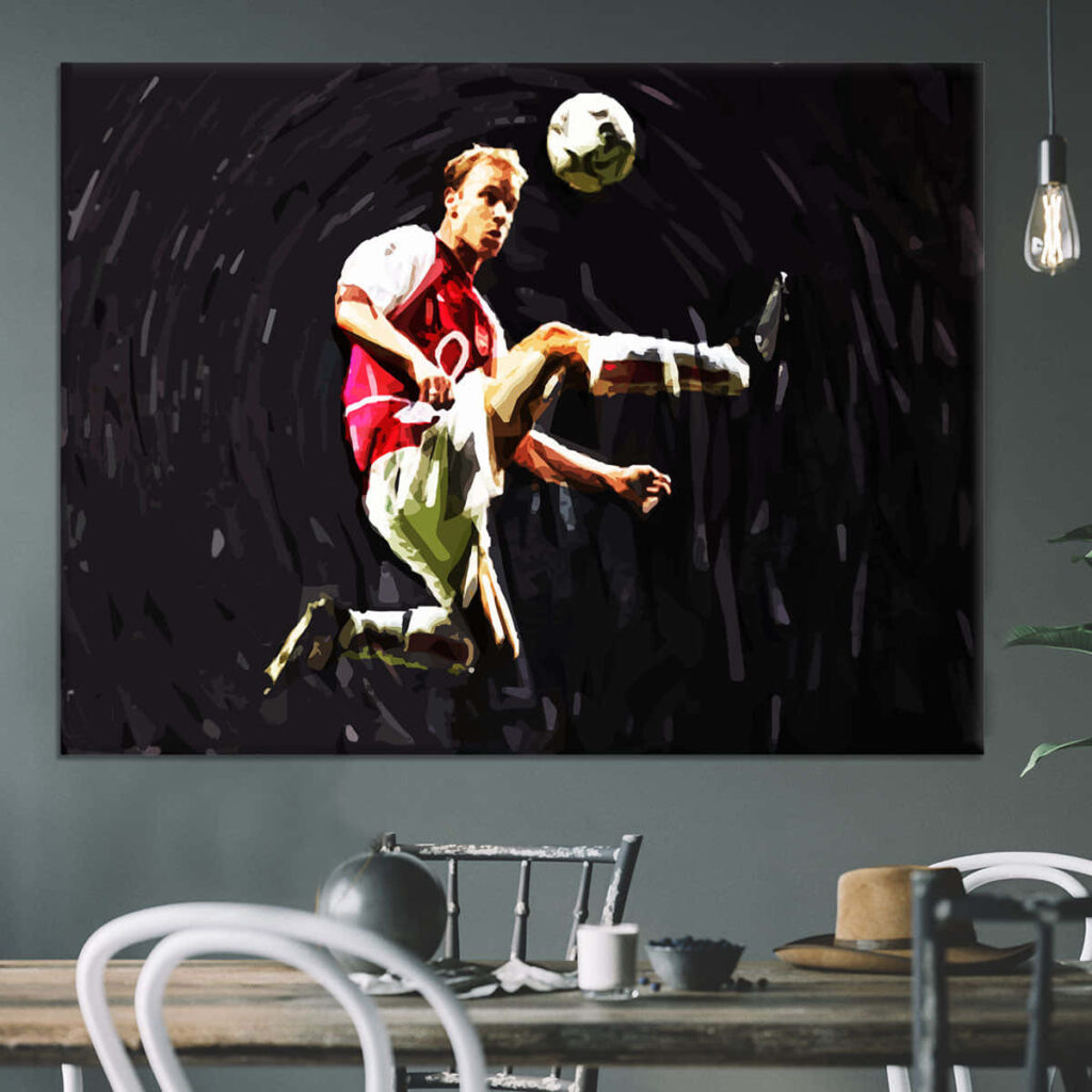 Dynamic paint art of Dennis Bergkamp skillfully controlling soccer ball in Arsenal kit wallpaper