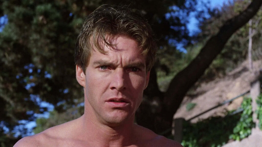 Dennis Quaid outdoors in natural sunlight with leafy background casual style cinematic vibe wallpaper
