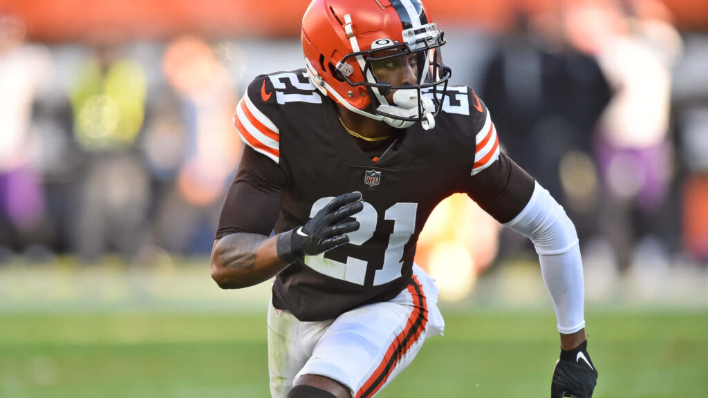 Denzel Ward Cleveland Browns in action vs Baltimore Ravens vibrant NFL stadium wallpaper background