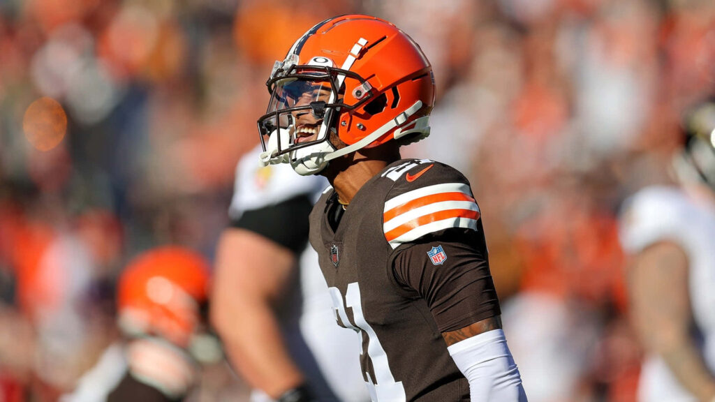 Denzel Ward in Cleveland Browns uniform showing intense action during an NFL football game Wallpaper