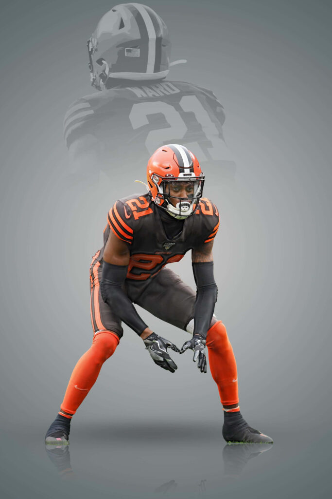 Denzel Ward Cleveland Browns in dynamic defensive pose modern sports poster wallpaper background