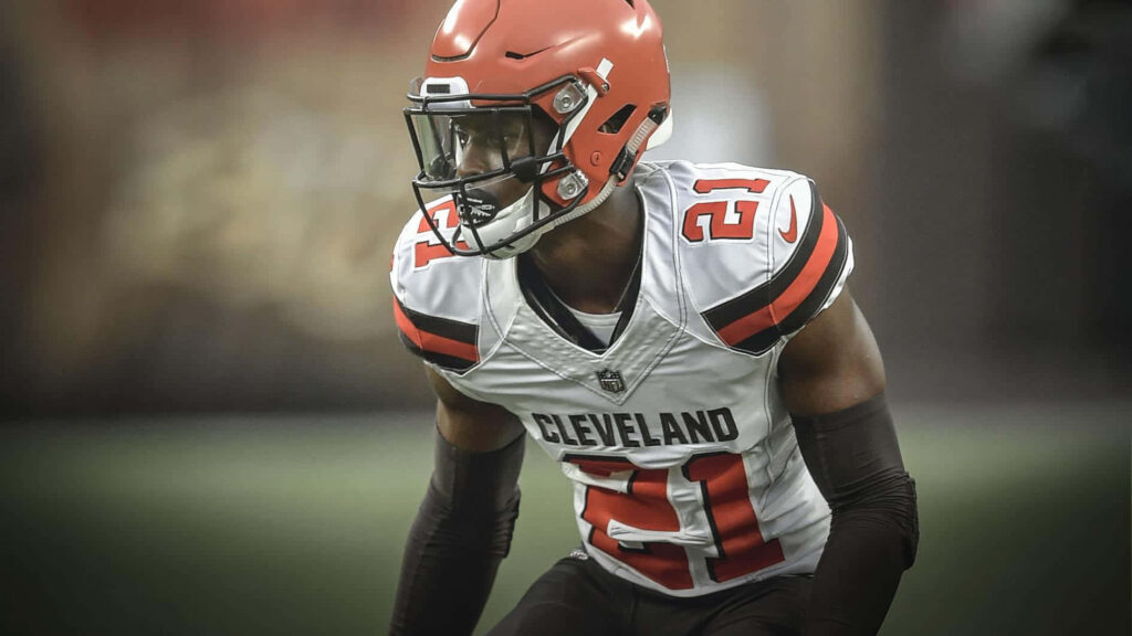Denzel Ward Cleveland Browns wallpaper intense NFL cornerback in uniform with dynamic posture