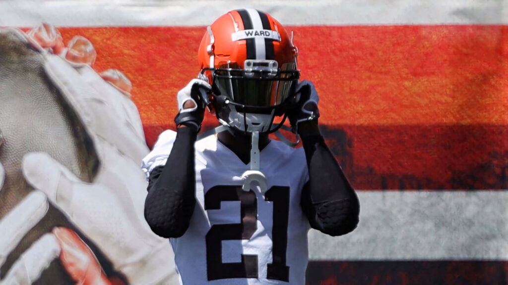 Denzel Ward Cleveland Browns wallpaper with bold striped background capturing intense focus