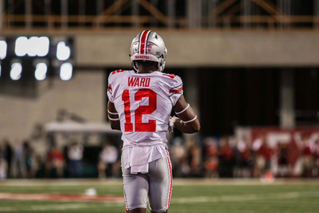 Denzel Ward in Ohio State Jersey: Dynamic Game Wallpaper Background