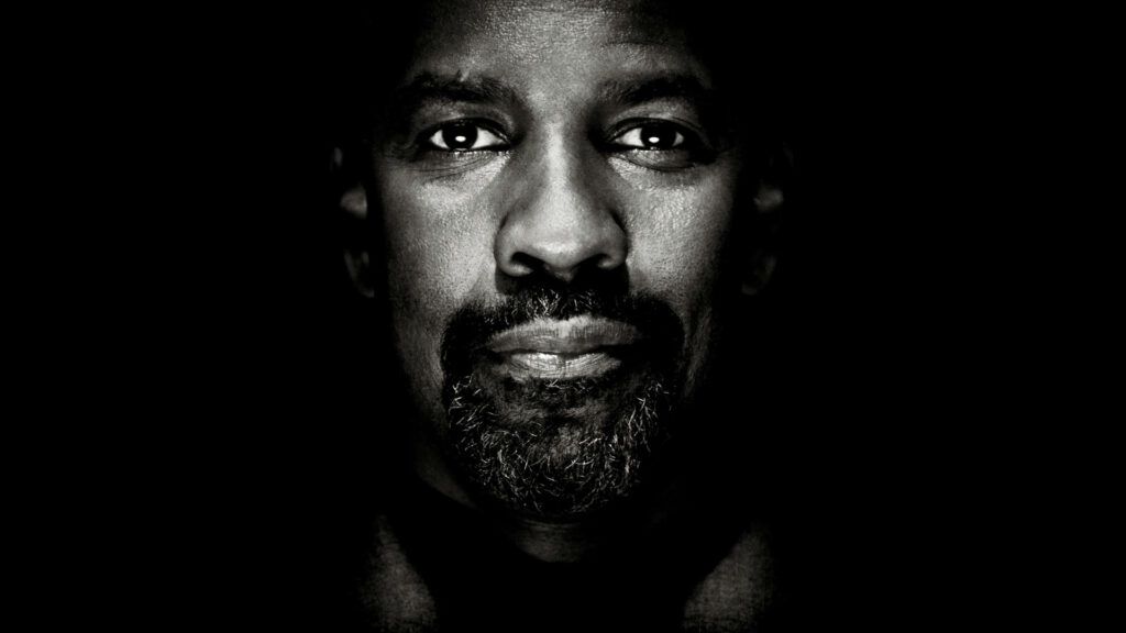 Close up black and white portrait of Denzel Washington with intense expression and dramatic lighting Wallpaper