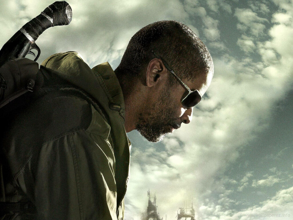 Denzel Washington intense side profile sunglasses rugged jacket cloudy sky dramatic background wallpaper