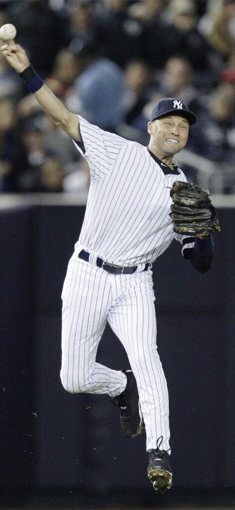 Derek Jeter airborne throwing baseball in Yankees pinstripe uniform with stadium crowd background Wallpaper