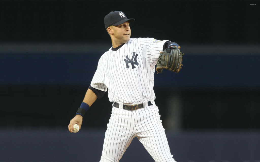Derek Jeter in Yankees pinstripes throwing baseball action shot with blurred stadium background Wallpaper