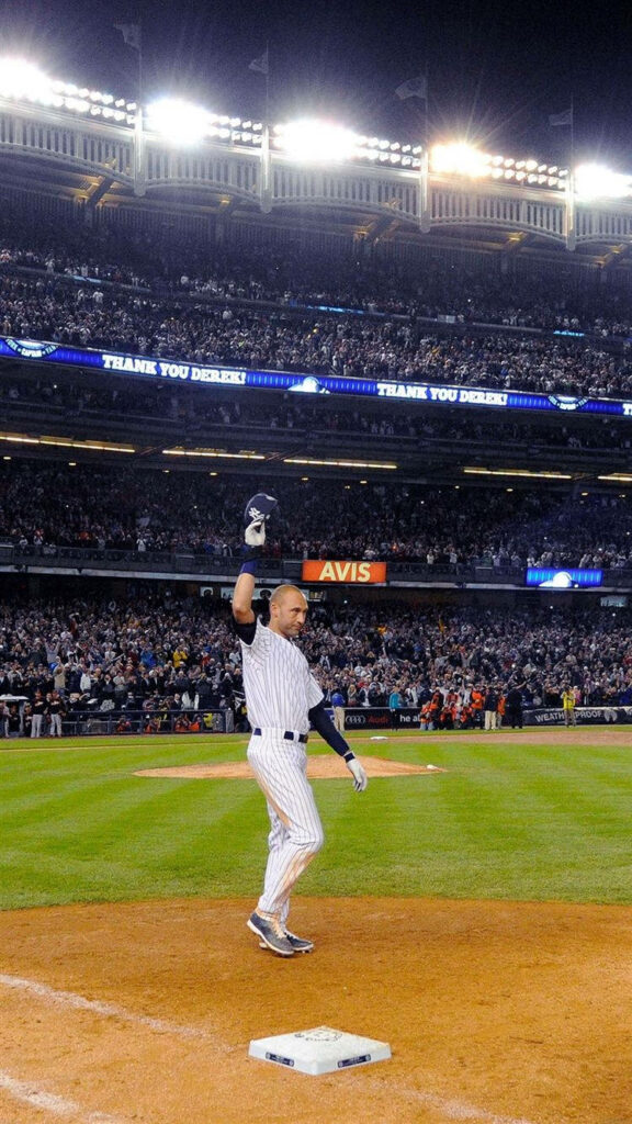 Derek Jeter Yankees wallpaper raising helmet celebrating at night stadium cheering crowd background