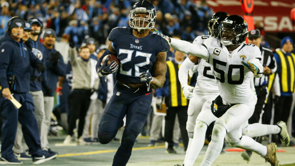Derrick Henry sprinting past Jacksonville Jaguars defenders in vibrant NFL football action wallpaper