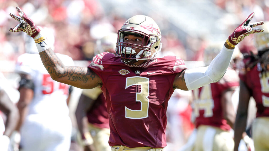 Derwin James Jr Florida State Seminoles celebrating game vibrant football wallpaper background