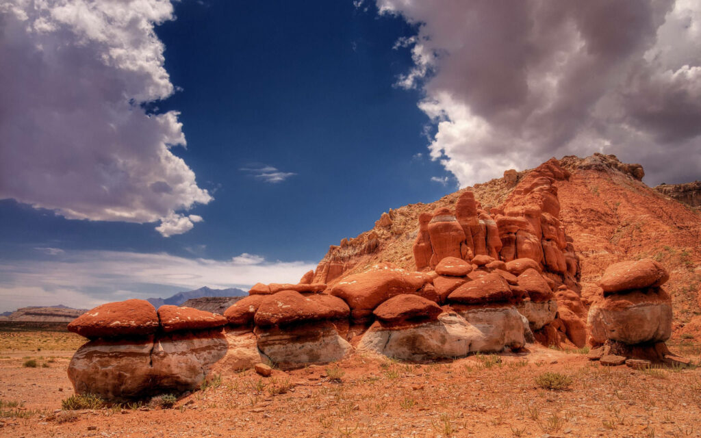 Marvelous Desert Formation: Majestic Pedestal Rocks Embraced by Golden Sands Wallpaper