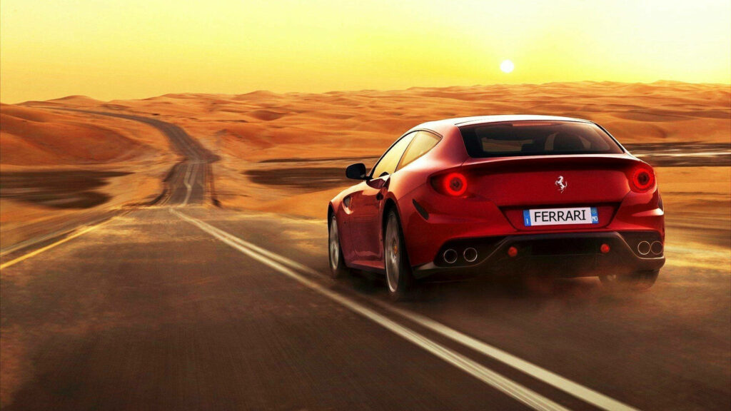 Desert Elégance: Majestic Red Ferrari FF Conquers Desert Terrain under the Fiery Sun - Exquisite 1920x1080 Wallpaper