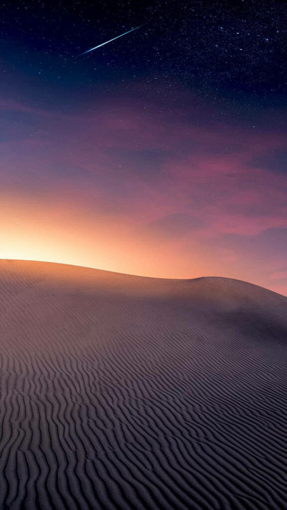 Captivating Sunset Serenade Over Desert Sands on Iphone Xs Max - An Awe-Inspiring Nightfall Canvas for Your Device Wallpaper