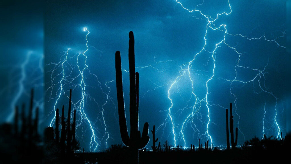 Enchanting Desert Thunder: A Mesmerizing 3D Display of Lightning amidst the Magical Silhouette of Desert Cacti Wallpaper