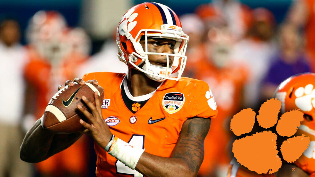 Deshaun Watson Clemson Tigers orange uniform action wallpaper with vibrant paw print logo background