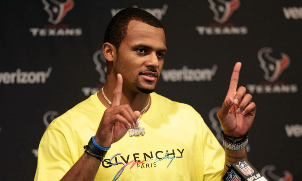 Deshaun Watson at Texans press conference wearing bright yellow Givenchy shirt and bracelets Wallpaper