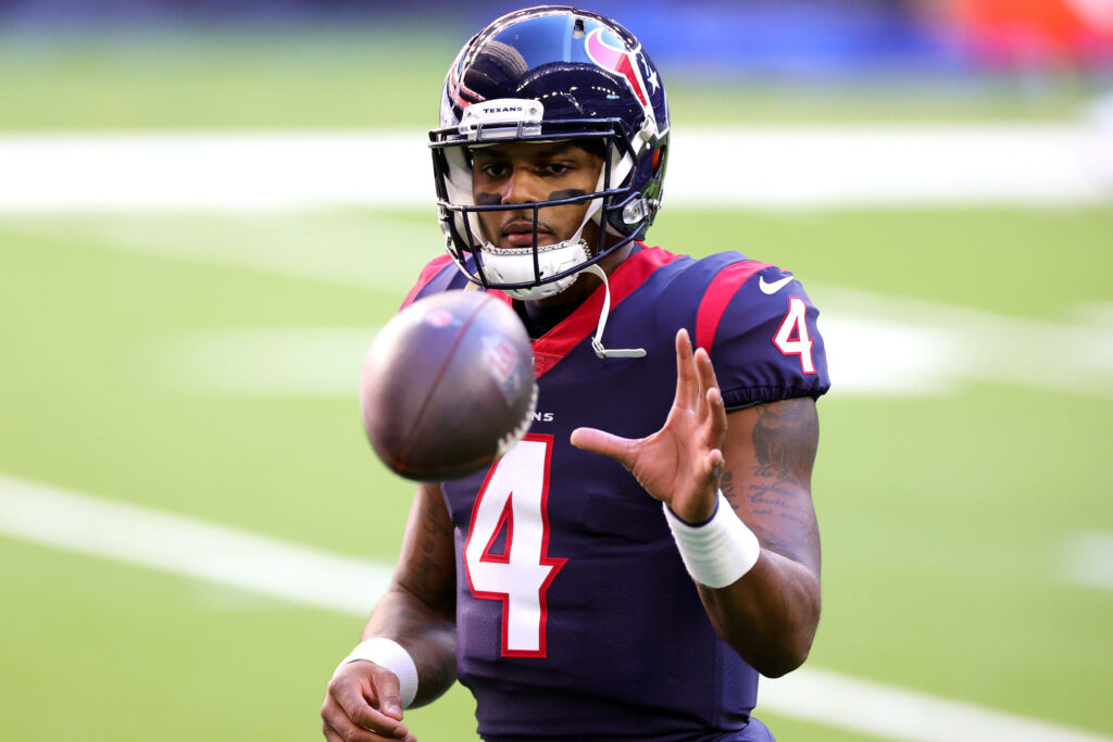 Deshaun Watson catches football in Houston Texans navy and red uniform athletic game action wallpaper