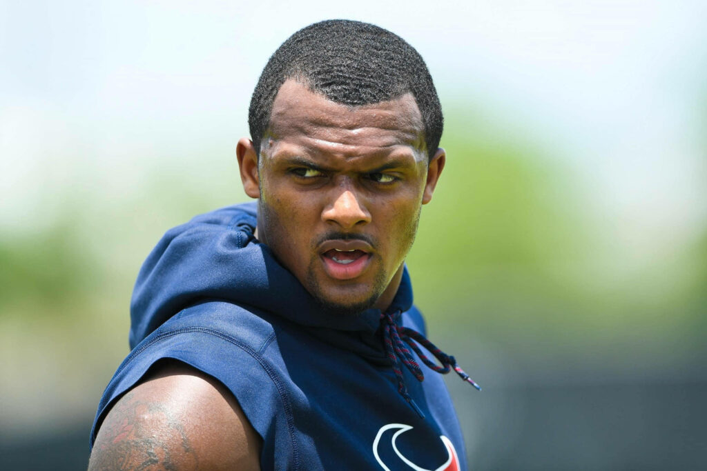 Deshaun Watson intense Houston Texans training sleeveless blue hoodie athletic focus outdoor background Wallpaper