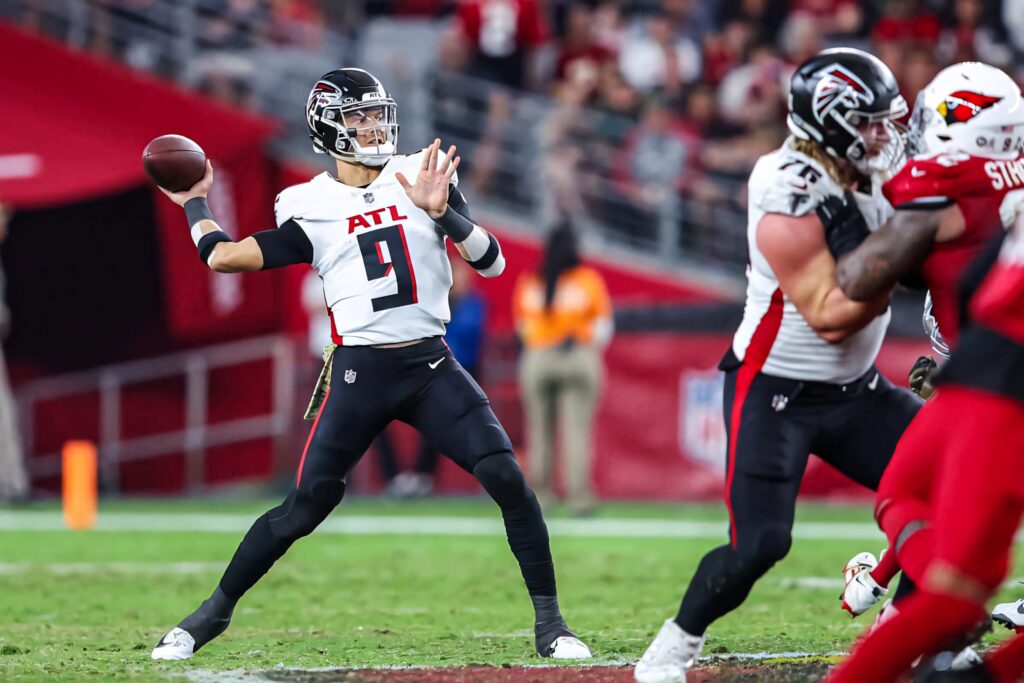 Desmond Ridder Atlanta Falcons quarterback prepares to throw football in intense NFL game action Wallpaper