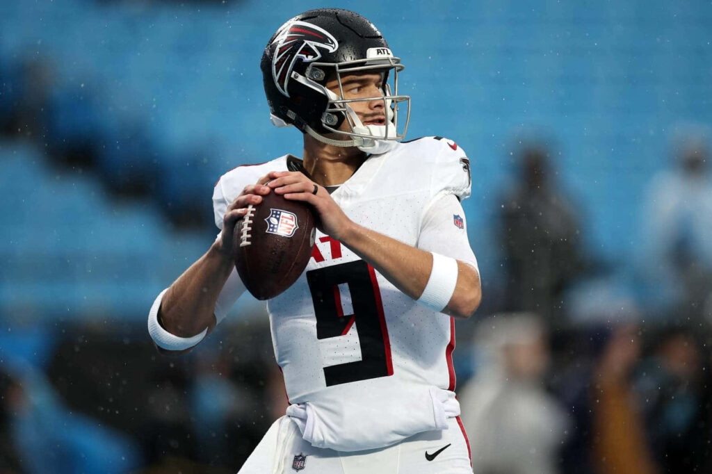 Desmond Ridder Atlanta Falcons quarterback ready to throw football on vibrant stadium field wallpaper