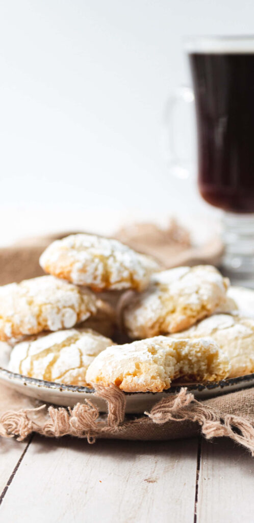 Sweet Delights: Indulging in Freshly-Baked Amaretti Cookies with a Cup of Black Coffee Wallpaper
