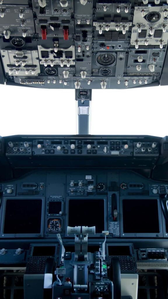 Detailed commercial airplane cockpit with control panels switches and digital screens in metal tones Wallpaper