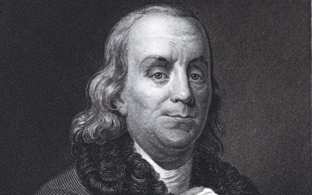 Greyscale portrait of Benjamin Franklin wallpaper capturing his distinguished historical expression