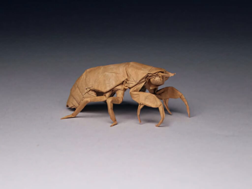 Origami cicada nymph brown paper sculpture detailed folds lifelike textures wallpaper background