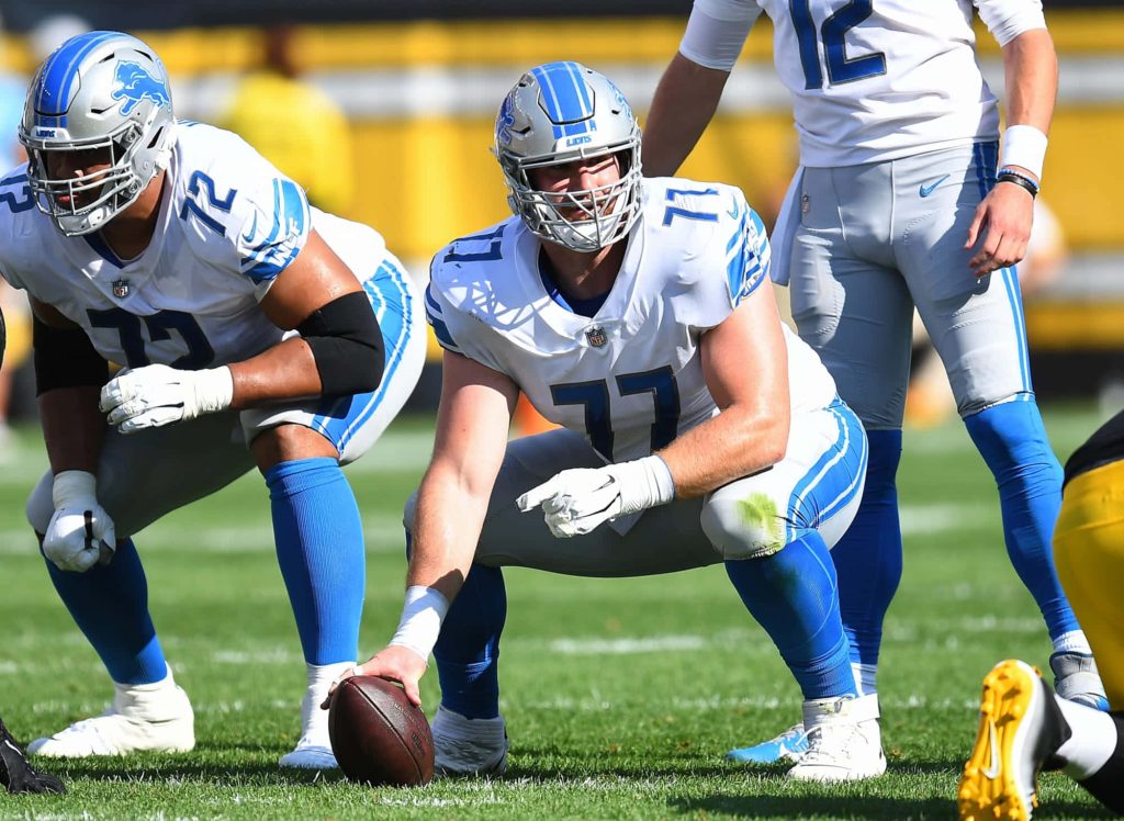 Detroit Lions center Frank Ragnow in blue silver uniform in pre snap stance HD wallpaper