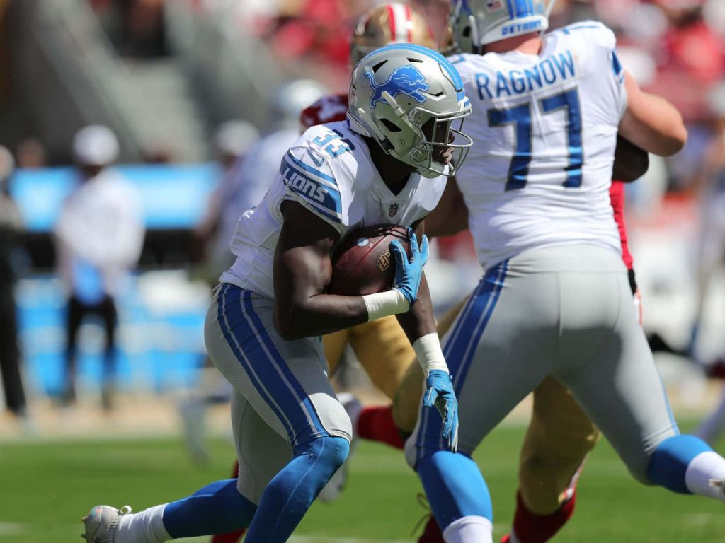 Detroit Lions NFL wallpaper Frank Ragnow blocking in Honolulu blue silver uniforms high-action game