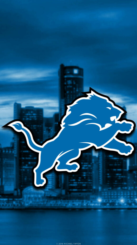 Detroit Lions iPhone wallpaper with blue lion logo over blurred Detroit cityscape background