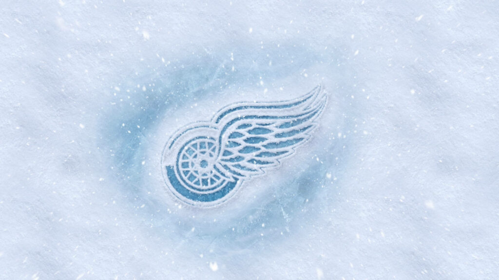 Detroit Red Wings logo etched in icy frost with snowy winter background hockey wallpaper