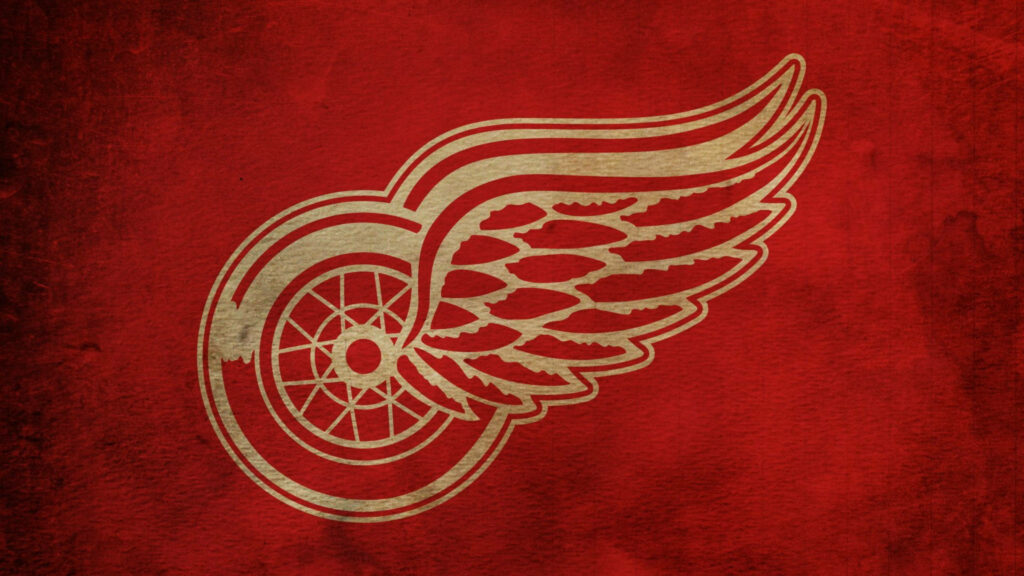 Detroit Red Wings gold winged wheel logo on textured red background NHL team wallpaper