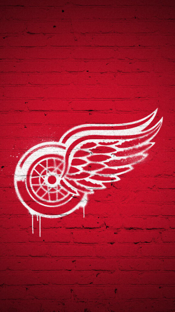 Detroit Red Wings white graffiti winged wheel logo on textured red brick urban street art background Wallpaper