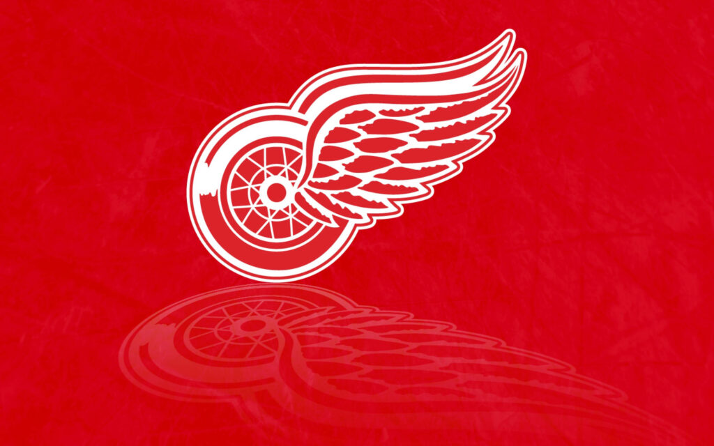 Detroit Red Wings logo wallpaper with bold red white winged wheel on textured red background