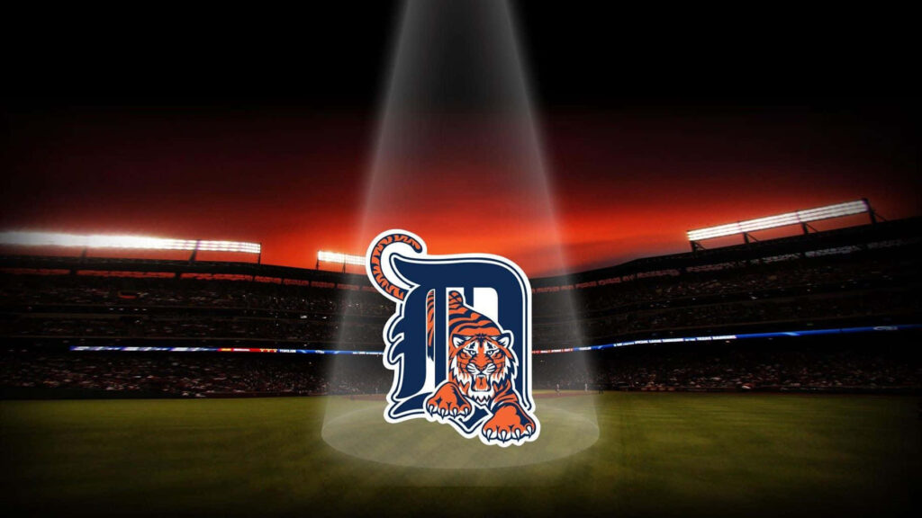 Detroit Tigers logo spotlighted in dark ballpark with dramatic red black sky background wallpaper