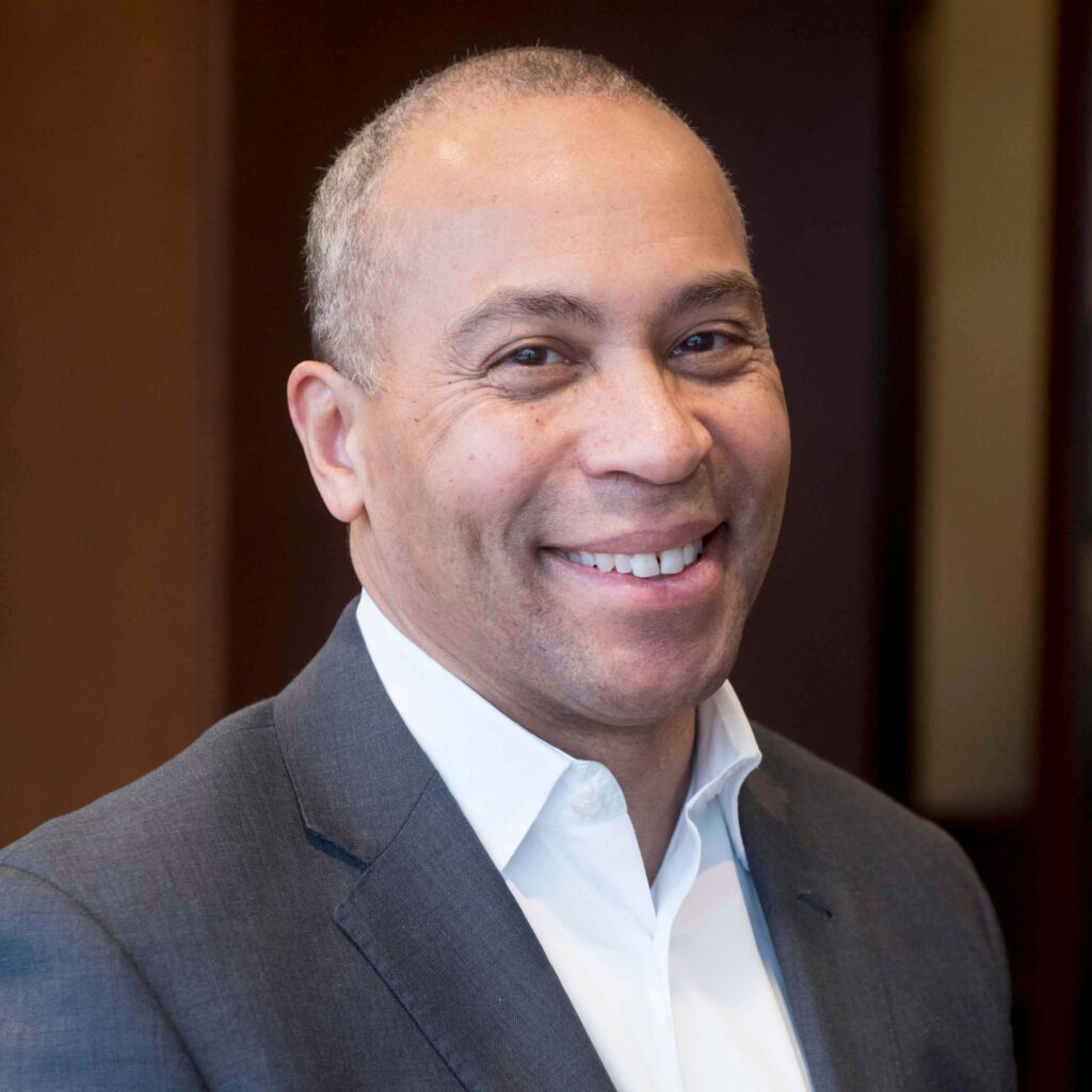 Deval Patrick headshot smiling in gray suit soft lighting professional background wallpaper