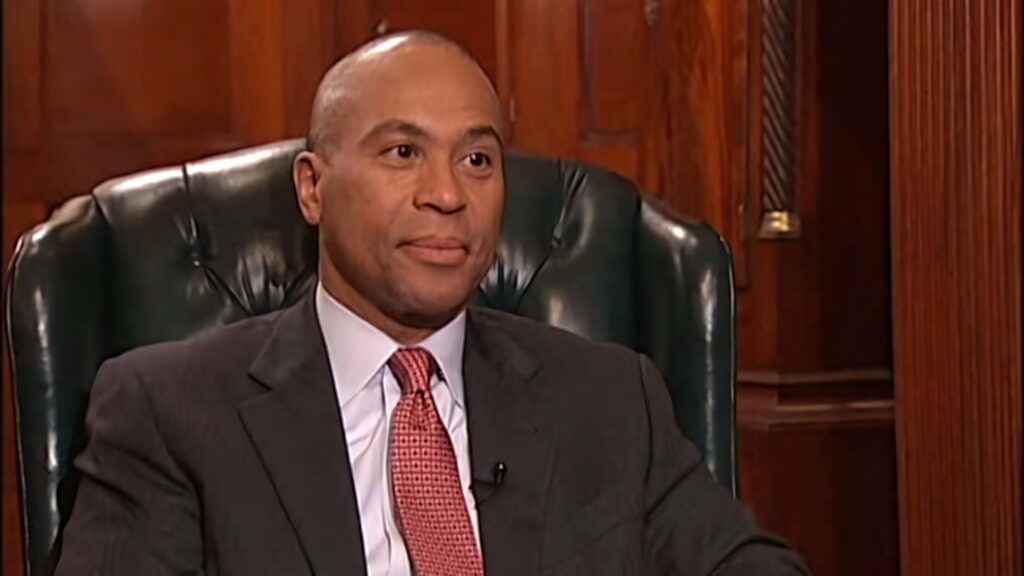 Deval Patrick in leather office chair with wood paneling professional business attire leadership Wallpaper