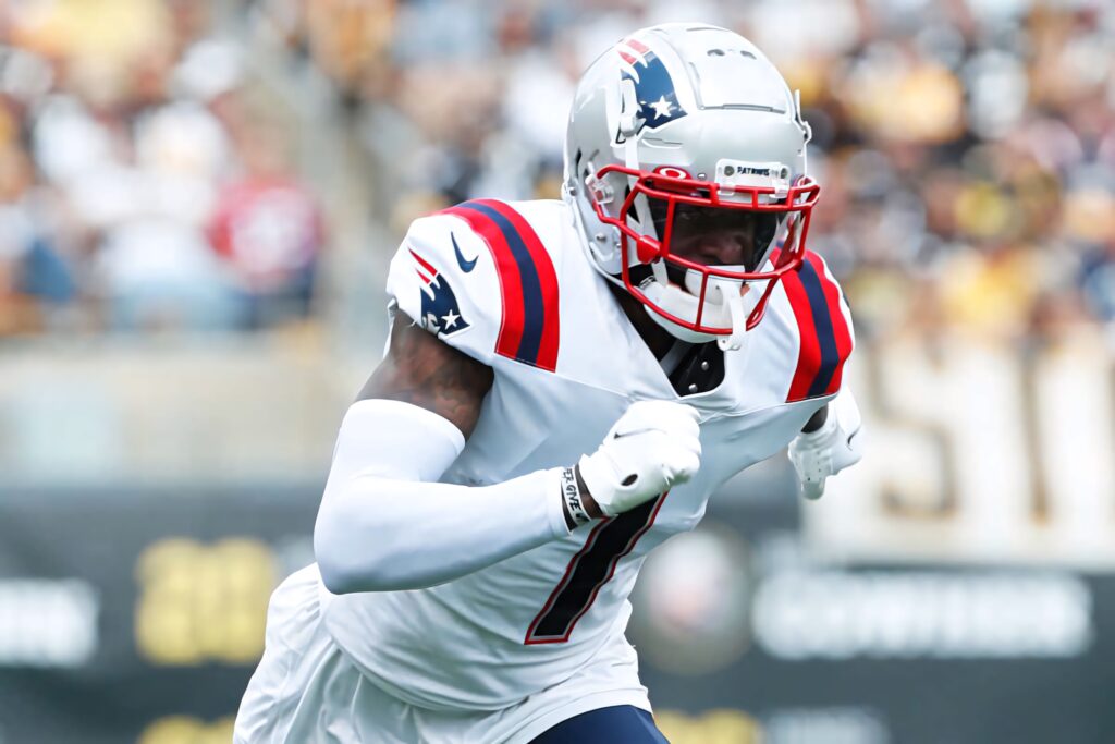 Devante Parker New England Patriots mid-stride intense action shot in white navy red uniform Wallpaper