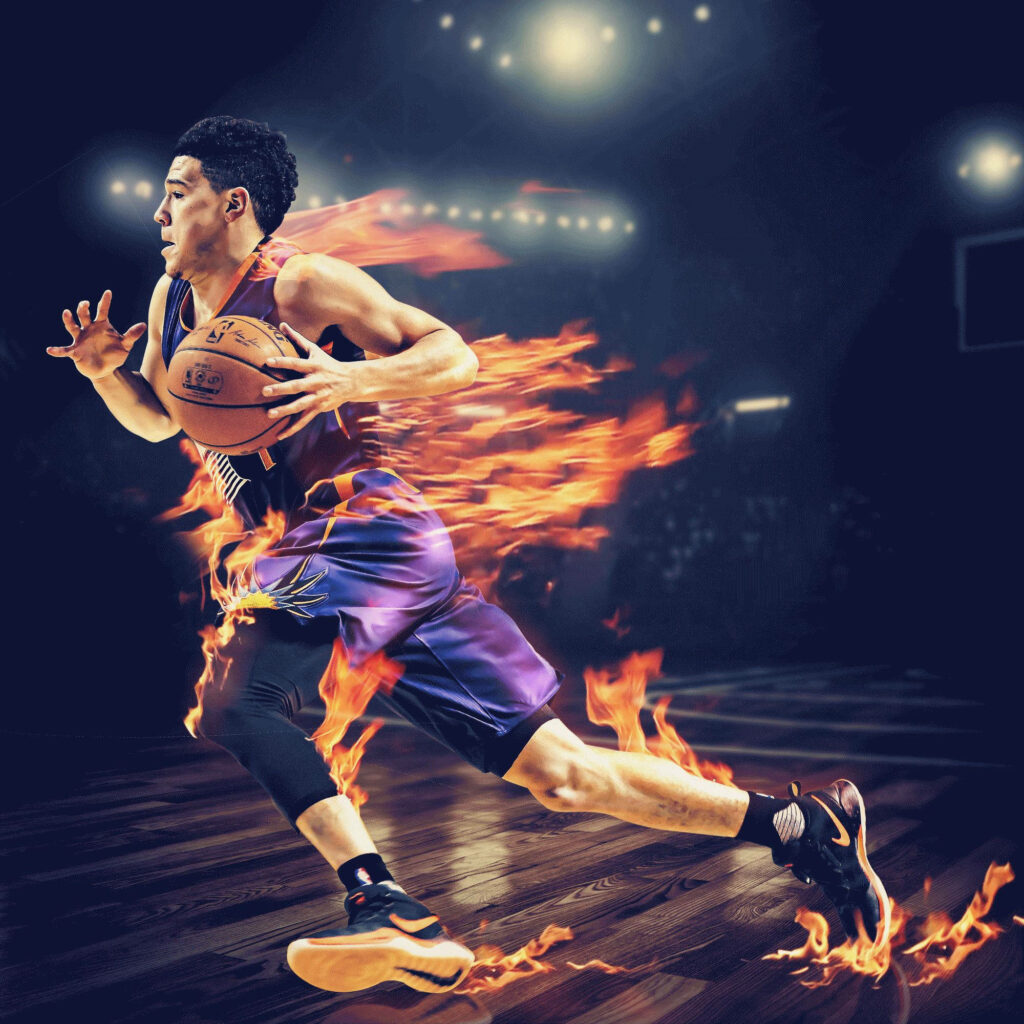 Devin Booker in dynamic Phoenix Suns uniform with fiery flames on vibrant basketball court background Wallpaper