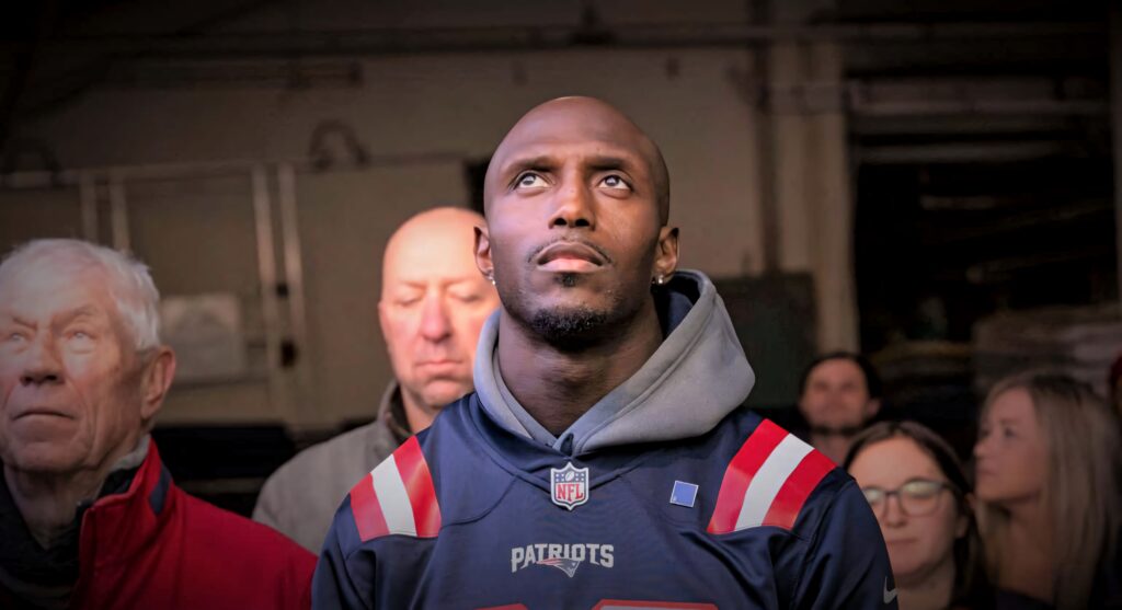 Devin McCourty focused on field in New England Patriots jersey dynamic NFL athlete wallpaper background